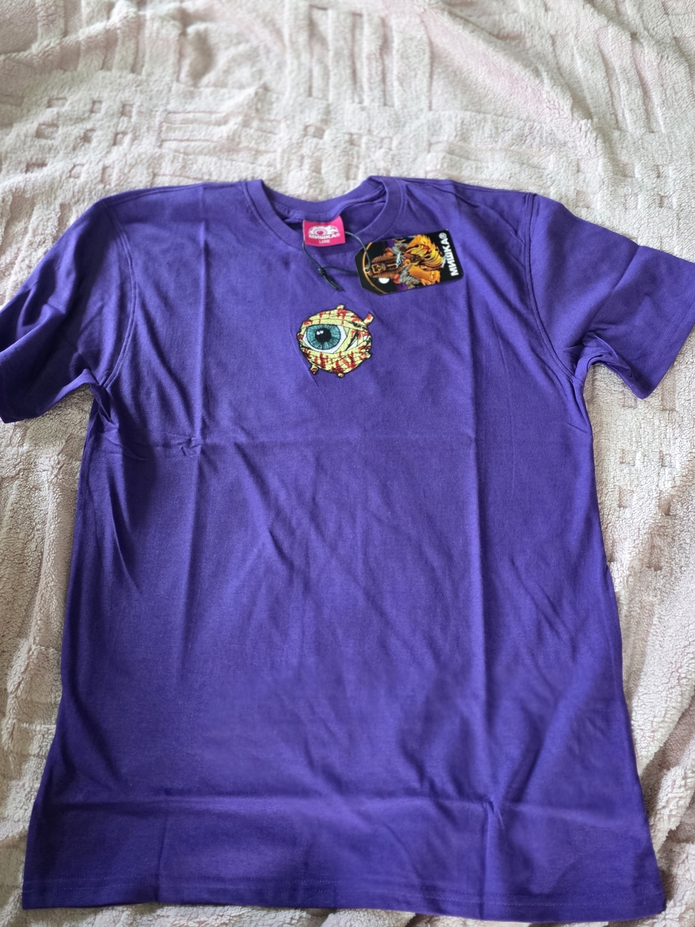 Mishka graphic t-shirt features the brand's iconic "Keep Watch" eyeball logo